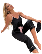 Black satin pajama set with pink trim and black eye mask