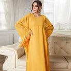 Mustard yellow abaya langry fashion with fringed sleeves and flowing silhouette