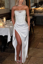 Elegant white strapless split dress with thigh-high slit, perfect for casual parties