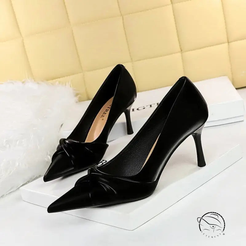 Black velvet pointed toe stiletto heels with bow detail by Langry fashion