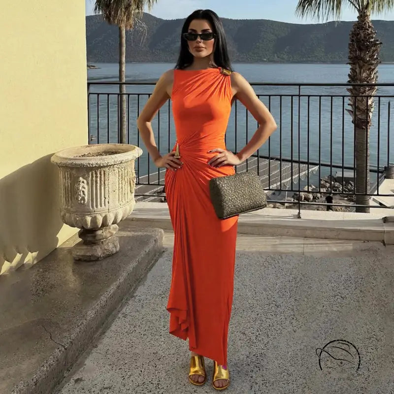Elegant langry fashion orange sleeveless maxi dress with gold heels and clutch