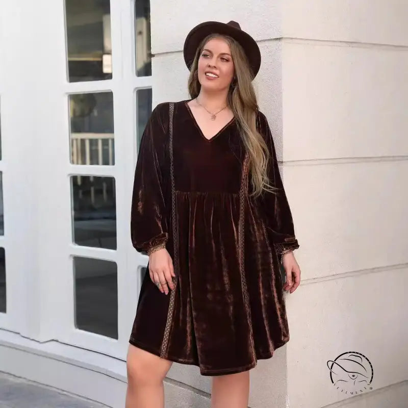 Woman in loose slimming casual brown velvet babydoll dress