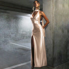 Elegant champagne-colored satin halter dress showcasing a stylish split dress design