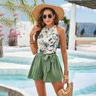 Woman’s floral halter top and green shorts outfit from Gorgeous Short Halterneck Vest Two Piece