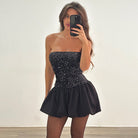 Elegant off the shoulder short dress featuring a strapless black mini design and sequined bodice