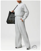 Light gray langry fashion jumpsuit with drawstring waist and long sleeves