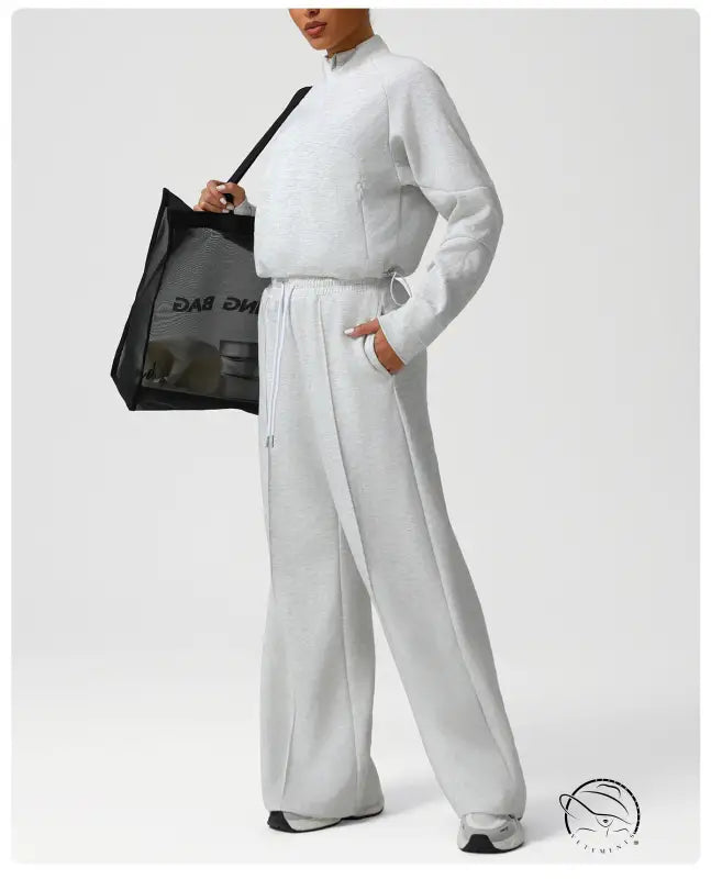 Light gray langry fashion jumpsuit with drawstring waist and long sleeves