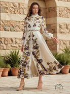 Elegant floral maxi dress with long sleeves, high collar, and retro patchwork design