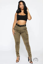 Woman in black crop top and casual skinny stretch belt sports pants