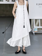 White layered cotton sundress with ruffled hem, embodying elegant Korean style