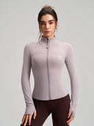 Long sleeve lavender zip-up yoga jacket with ribbed cuffs and stretchy fabric