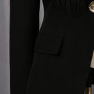 Elegant business blazer with black high-waisted pants, gold buttons, fringe details in langry fashion