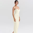 Form-fitting cream-colored maxi split dress showcasing autumn classic texture for women