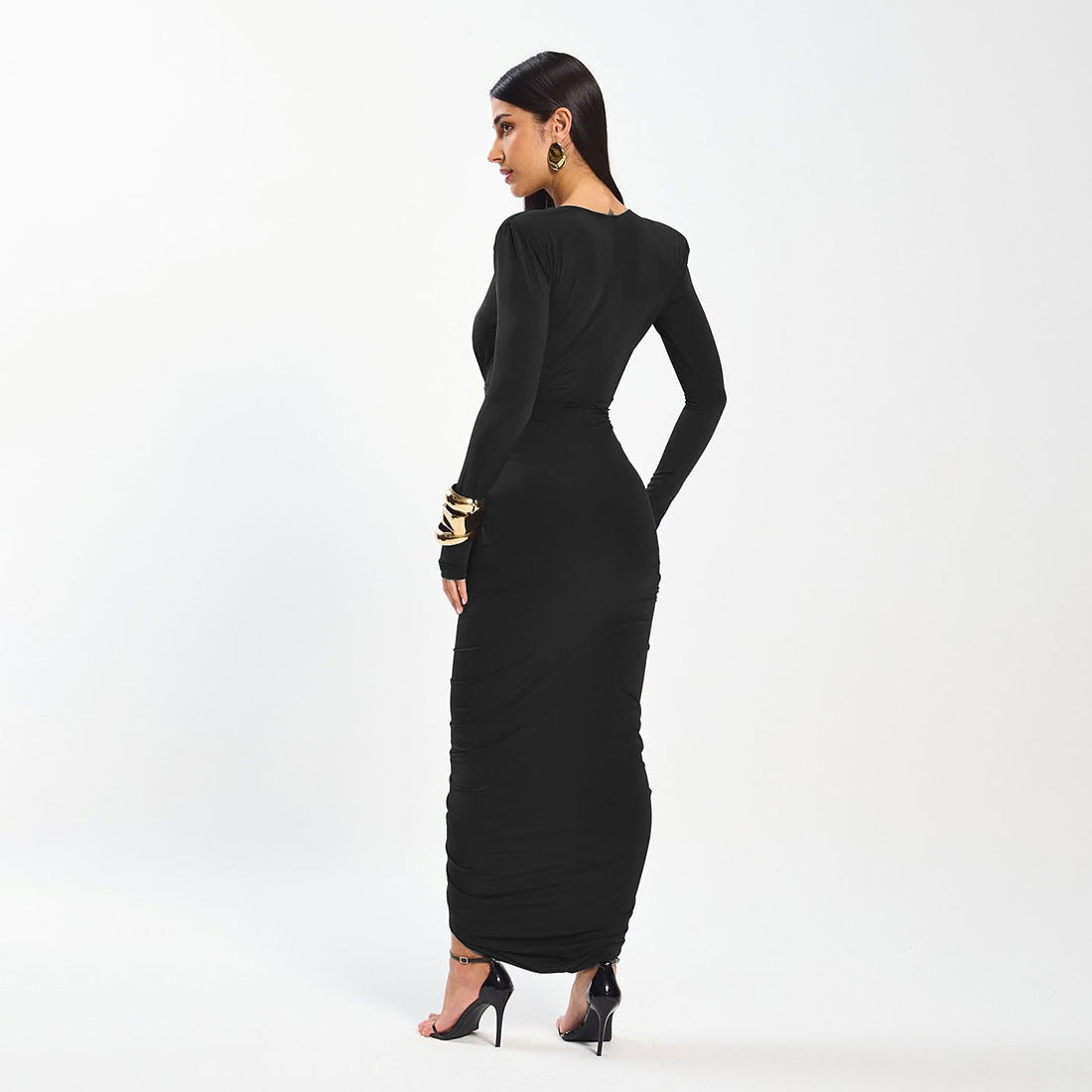 Elegant slim black ruched maxi dress with long sleeves and gold accents in Langry fashion