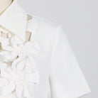 Elegant white floral-embellished blouse from French Tea Break Dress Summer Polo Collar collection featuring high waist fashion ملابس