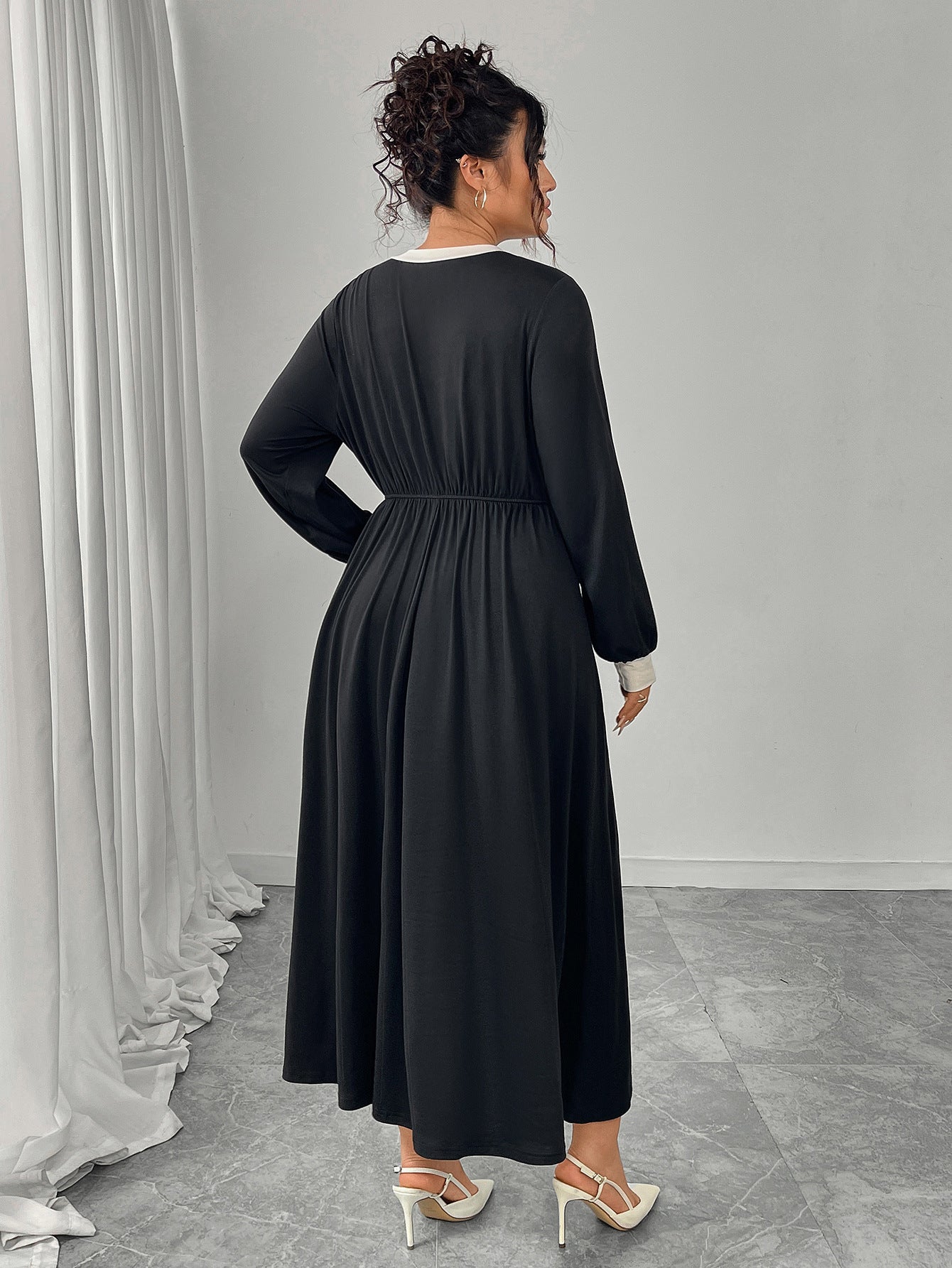 Plus size black maxi dress with white trim and pleated skirt by Langry fashion