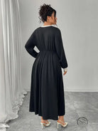 Plus size black dress with white trim and pleated skirt in Langry fashion