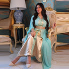 Elegant langry fashion two-piece dress in light blue silk kaftan with gold embroidery, white pants, beige heels