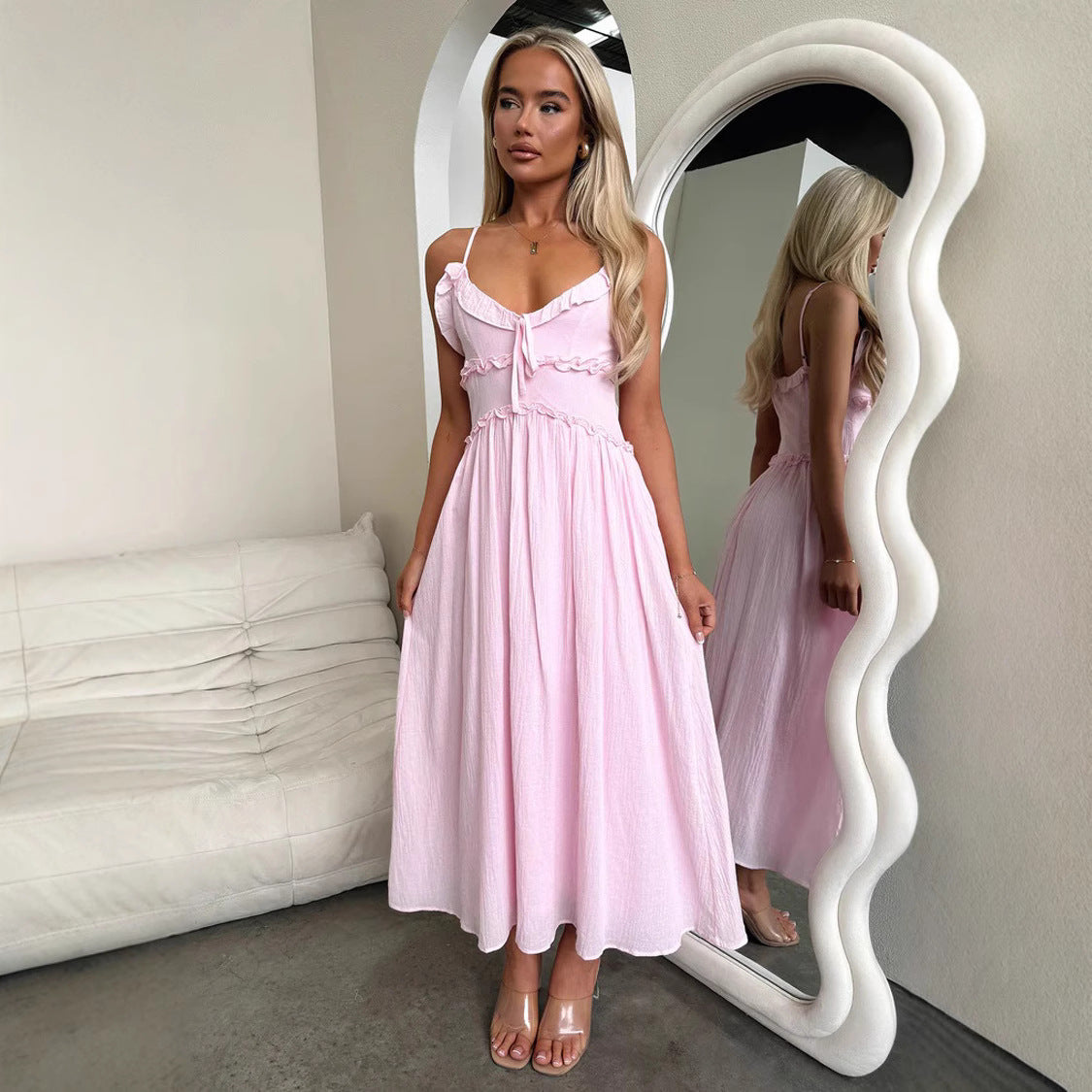Pink spaghetti-strap midi dress with sweetheart neckline, perfect for elegant fashion ملابس