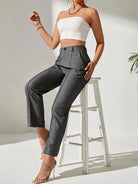 Gray high-waisted dress pants with straight-leg tailoring for women’s business fashion