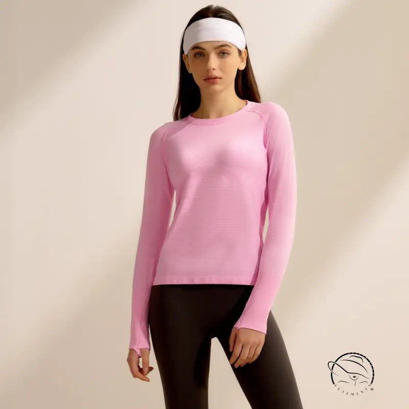 Pink langry quick-drying running top with black leggings and white headband