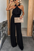 Black halter jumpsuit from the Summer Casual collection, ideal for vacation fashion