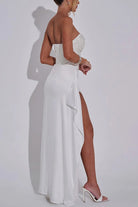 White strapless split dress with a thigh-high slit, perfect for casual party fashion