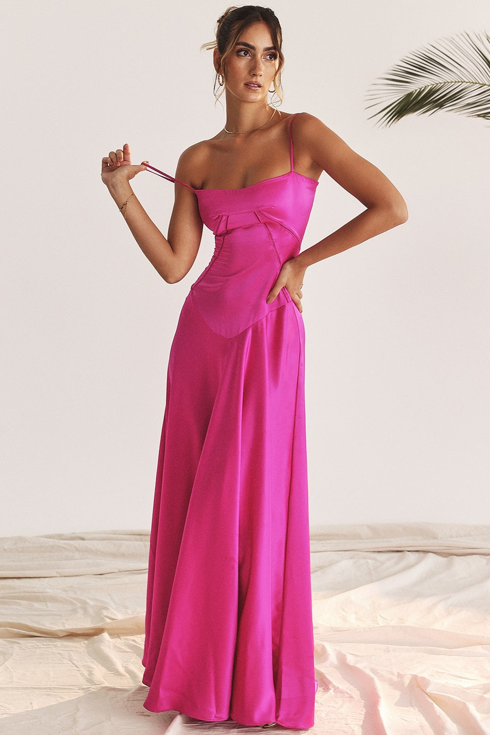 Fuchsia satin maxi dress, a stunning backless evening attire for stylish fashion choices