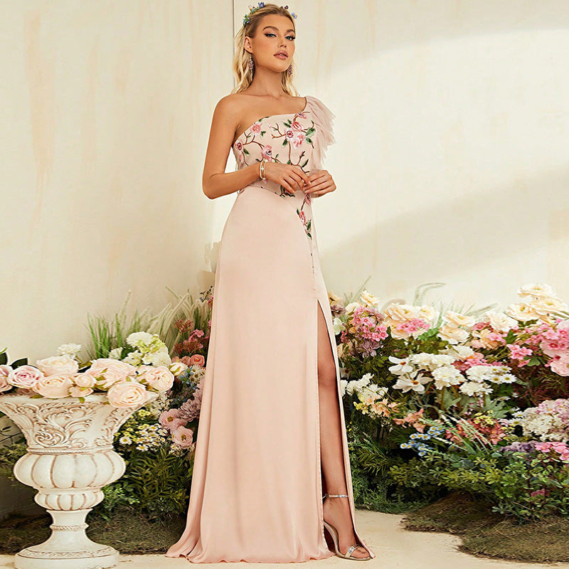 Strapless blush pink evening gown with thigh-high slit, perfect for attractive cocktail parties