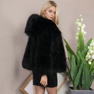 Cozy black faux fur coat with plush voluminous hood from Langry fashion