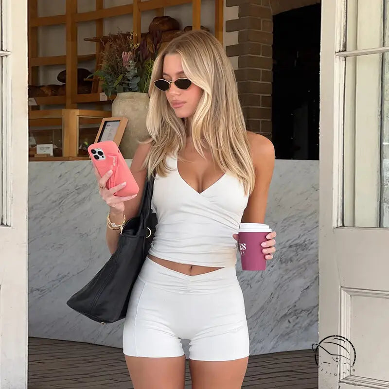 Langry fashion white textured v-neck crop top and high-waisted shorts set for yoga workouts