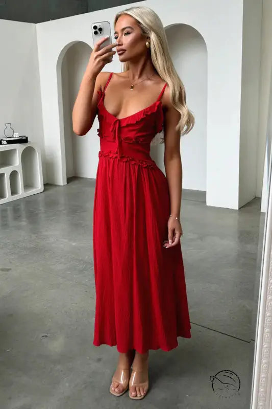 Elegant red loose dress with spaghetti straps and fitted bodice