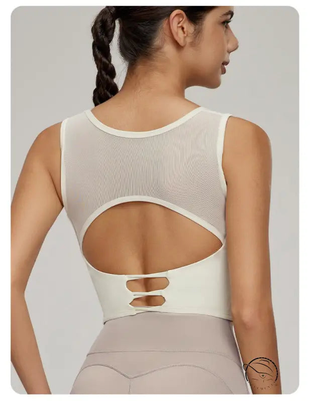 Woman modeling Beauty Back Mesh Workout Top with langry fashion mesh upper back