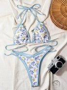 Stunning halter backless bikini in light blue white floral print with bow-tie neck