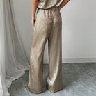 Langry golden high waist wide-leg pants in shimmering fashion ملابس