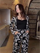 Woman in patterned suit from elegant ribbon two piece set