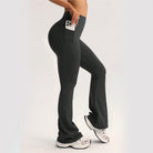 Black langry high-waisted flared yoga pants with side pocket holding white smartphone