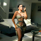 Woman in a stylish patterned cutout split dress, showcasing summer fashion trends
