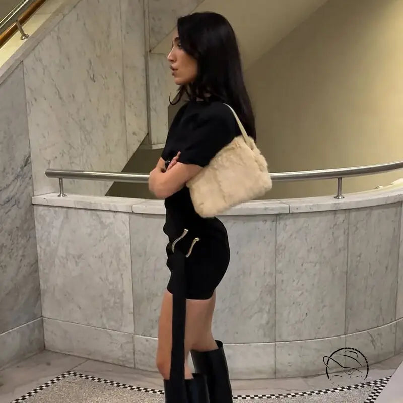 Woman in black short dress with furry bag, Langry fashion