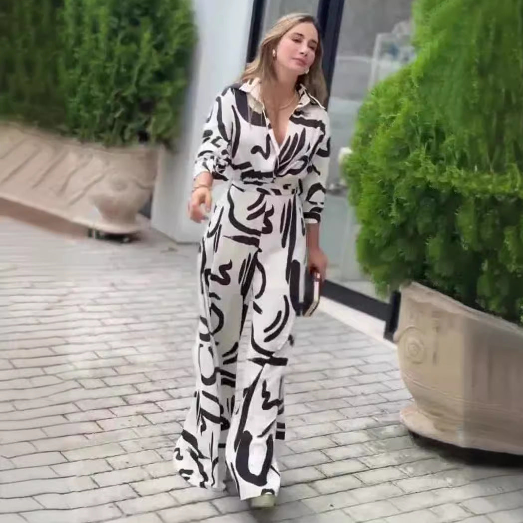 Woman wearing black and white patterned summer high waist jumpsuit, stylish and fashionable