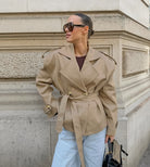 Trendy khaki langry fashion trench coat with belt detail