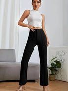 Black high-waisted flared pants showcasing a sleek silhouette for women’s casual fashion