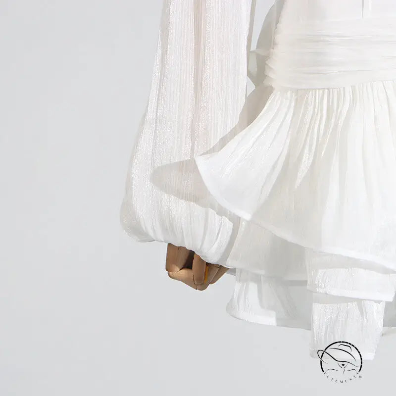 White ruffled blouse with bell sleeves in Langry fashion ملابس