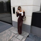 Attractive two-piece langry fashion dress with brown skirt, white straps and handbag