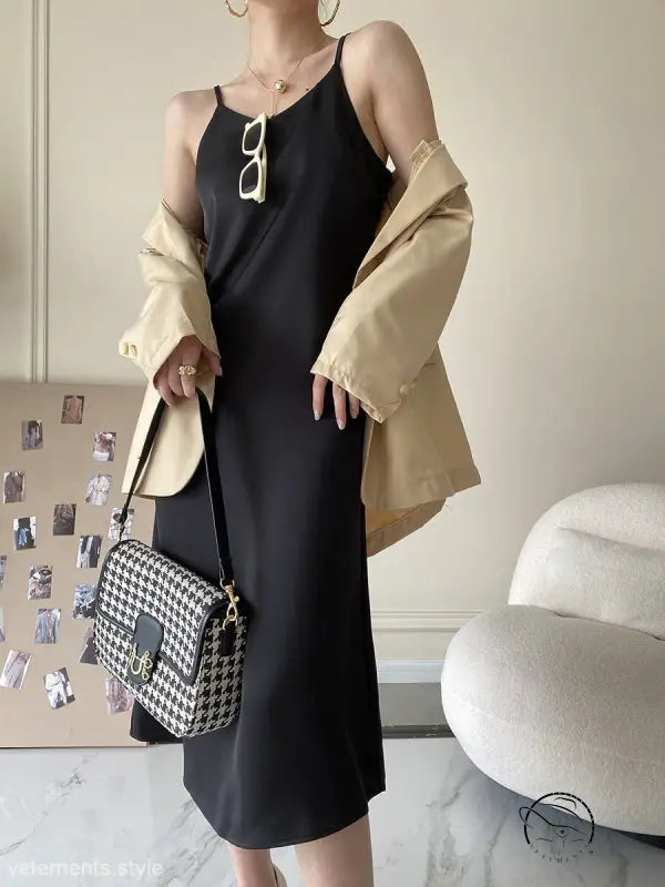 Obsidian black acetate satin dress with gold hardware and houndstooth bag