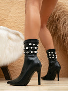 Elegant black stiletto ankle boots with rhinestone straps, perfect for fashionable ملابس and stylish looks