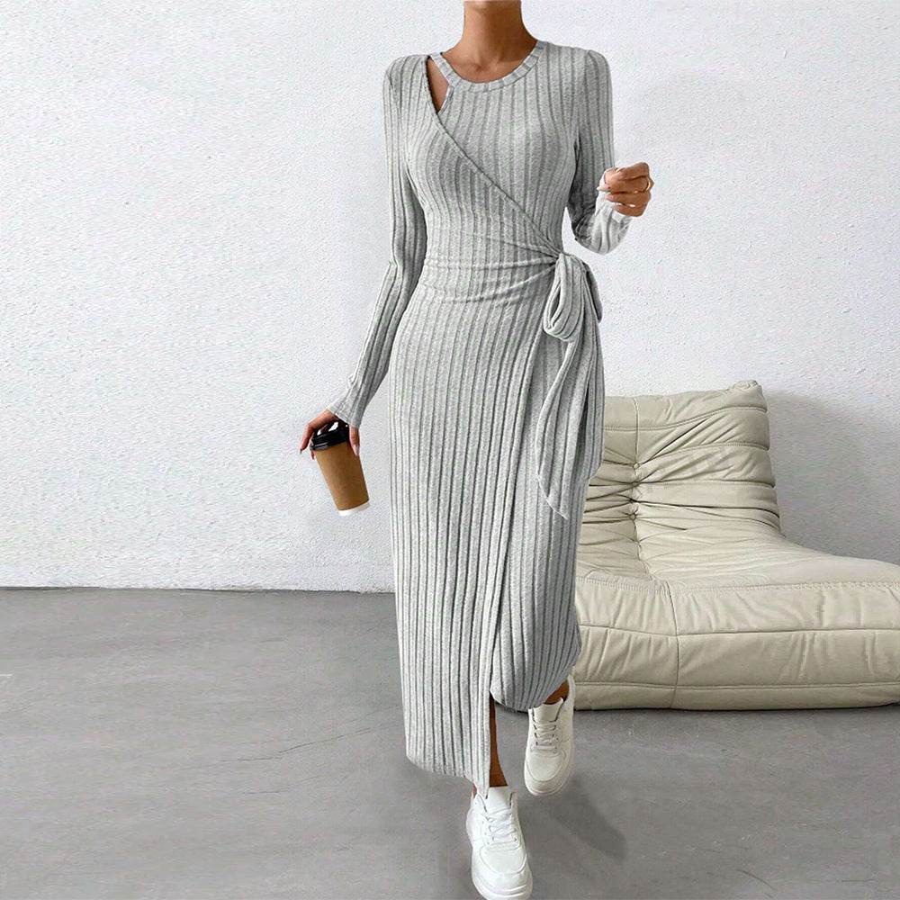 Warm knitted gray maxi dress with long sleeves, ribbed knit, side slit and self-tie waistband