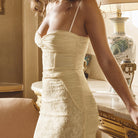 Elegant ivory lace cami dress showcasing sophisticated fashion and style