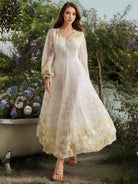 Enchanting white embroidered organza maxi dress with gold accents and lace details