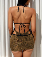 Leopard print mini skirt with black string bikini top from Bikini Double Three Piece Set